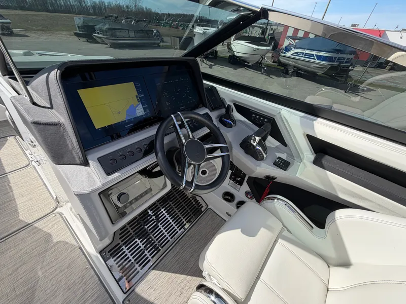 Slide: The Image of Interior of 2023 Cobalt R8 Outboard with modern helm station. - 10