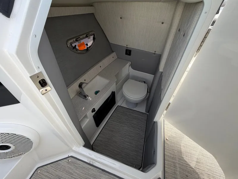 Slide: The Image of Interior of 2023 Cobalt R8 Outboard featuring toilet and sink. - 13