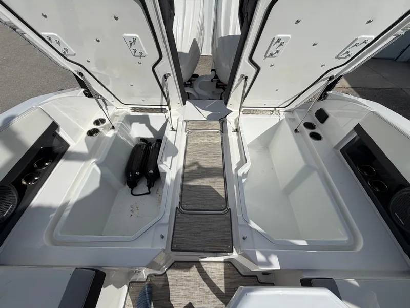 Slide: The Image of Interior of 2023 Cobalt R8 Outboard with storage compartments and cup holders. - 18