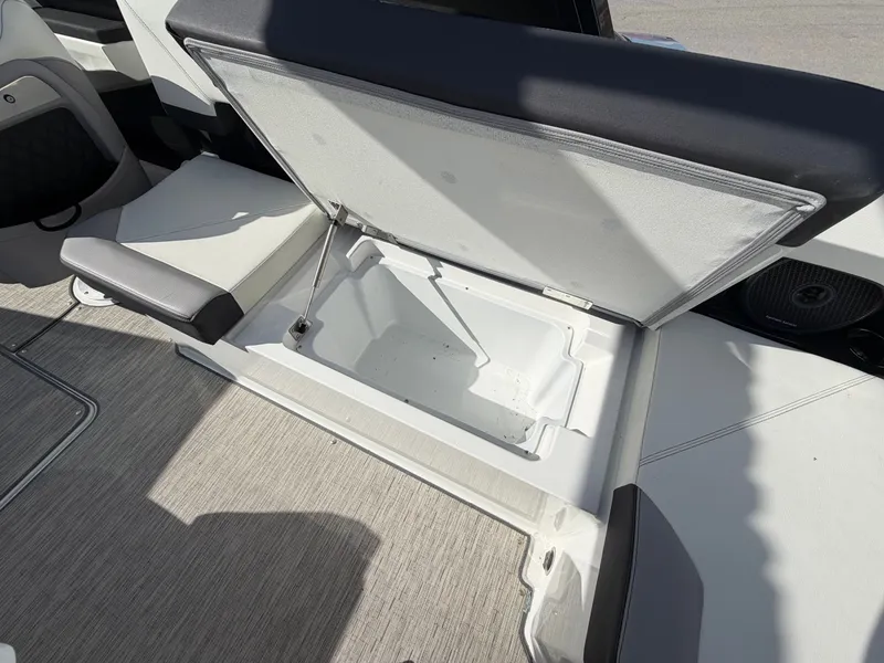 Slide: The Image of Cobalt R8 Outboard 2023 boat with open storage compartment. - 19