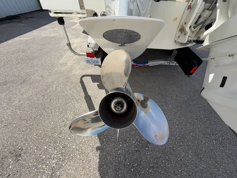 Slide: The Image of 2023 Cobalt R8 Outboard propeller on asphalt surface. - 21
