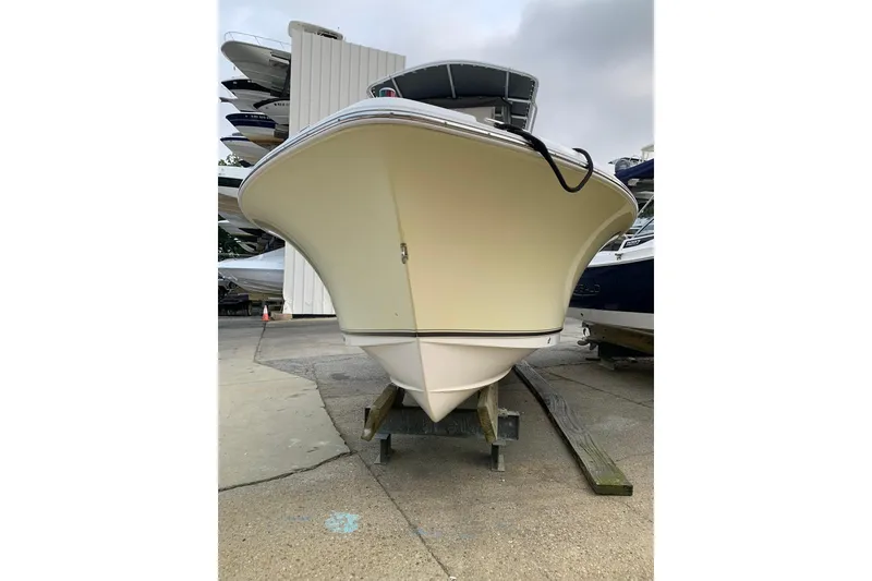 Slide: The Image of 2006 Sea Hunt Triton 220 boat on dry dock, front view. - 2