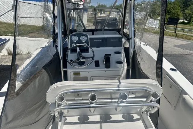 Slide: The Image of 2006 Sea Hunt Triton 220 boat interior with steering console and seating. - 36