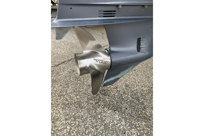 Slide: The Image of Propeller of a 2006 Sea Hunt Triton 220 boat on a textured surface. - 7