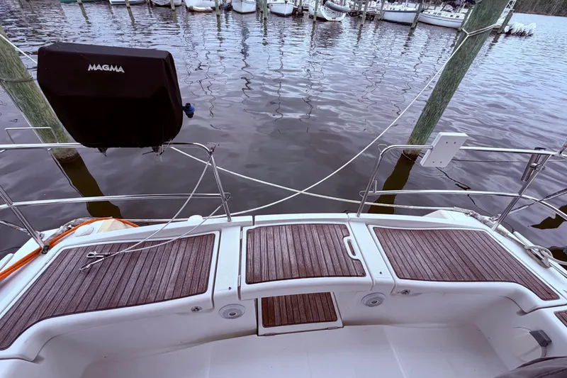 Slide: The Image of Beneteau Oceanis 40 sailboat stern view at dock, featuring teak decking, 2009 model. - 16