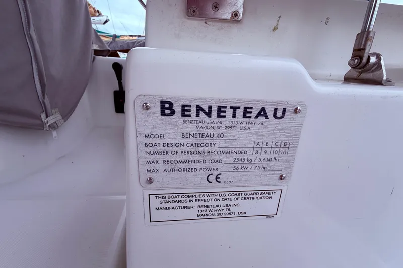 Slide: The Image of Plaque on 2009 Beneteau Oceanis 40 sailboat displaying specifications and safety information. - 18