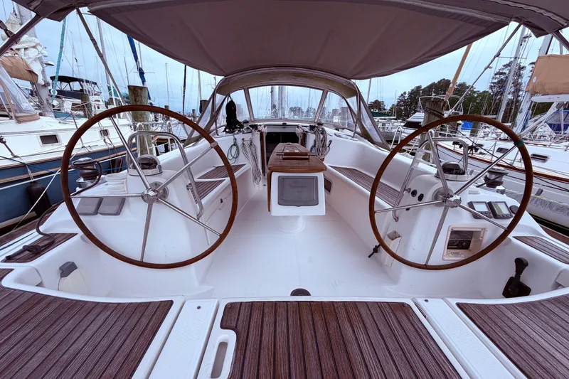 Slide: The Image of 2009 Beneteau Oceanis 40 sailboat cockpit with dual steering wheels at marina. - 34