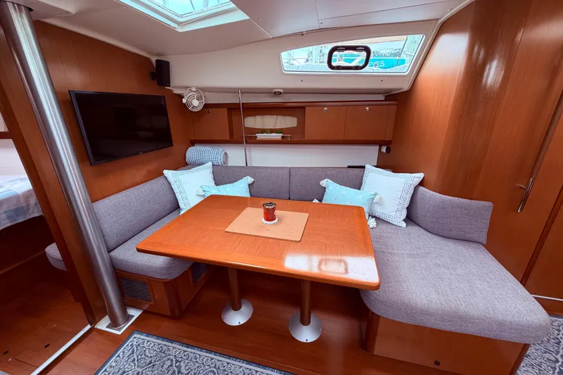 Slide: The Image of Interior of 2009 Beneteau Oceanis 40 yacht with cozy seating and modern amenities. - 45