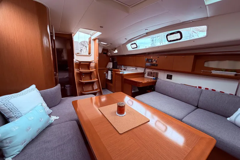 Slide: The Image of Interior of 2009 Beneteau Oceanis 40 yacht with cozy seating and wooden finishes. - 47