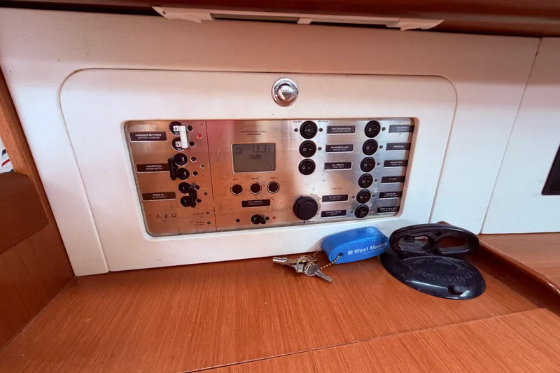 Slide: The Image of Interior of 2009 Beneteau Oceanis 40 yacht with cozy seating and wooden finishes. - 52