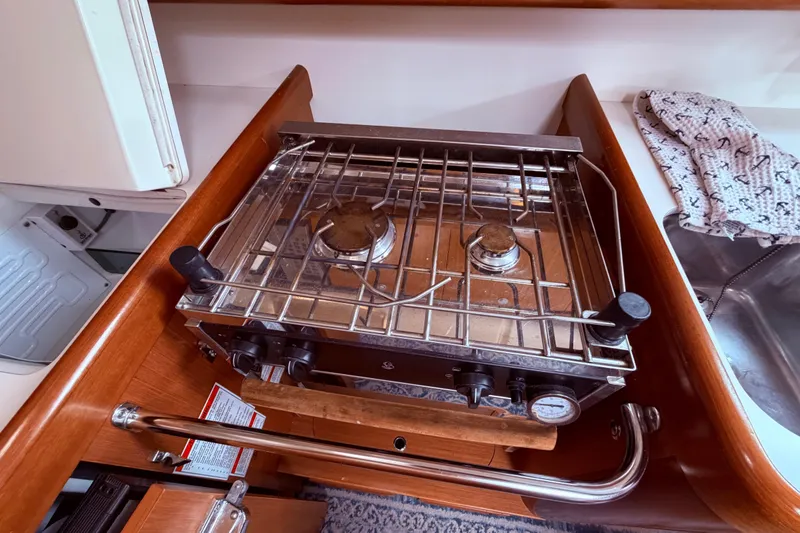 Slide: The Image of wooden vanity and cushioned stool in the v berth - 54