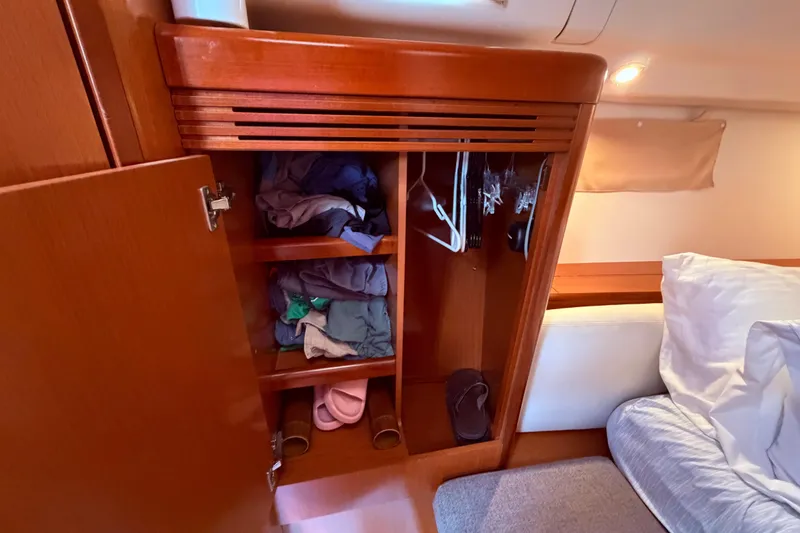 Slide: The Image of Compact bathroom in 2009 Beneteau Oceanis 40 yacht, featuring sink, mirror, and toilet. - 66