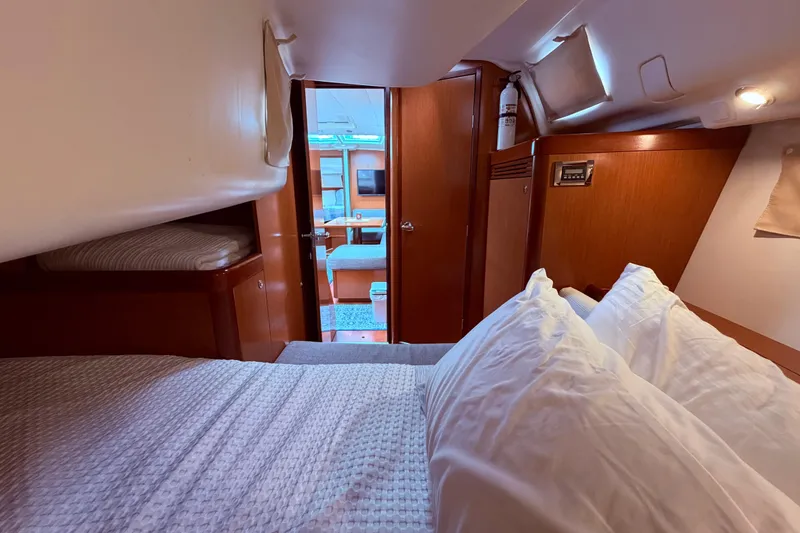 Slide: The Image of Bathroom interior of 2009 Beneteau Oceanis 40 yacht, featuring sink, mirror, and toilet. - 69