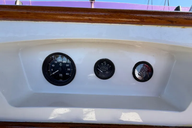 Slide: The Image of Dashboard of a 1982 Lien Hwa 31 boat with gauges and wooden trim. - 21