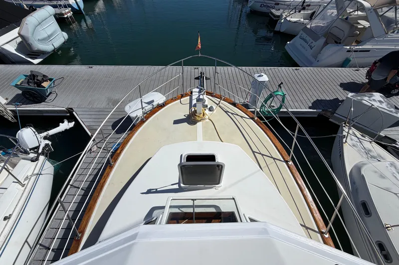 Slide: The Image of 1982 Lien Hwa 31 yacht docked at marina, viewed from above, surrounded by other boats. - 22