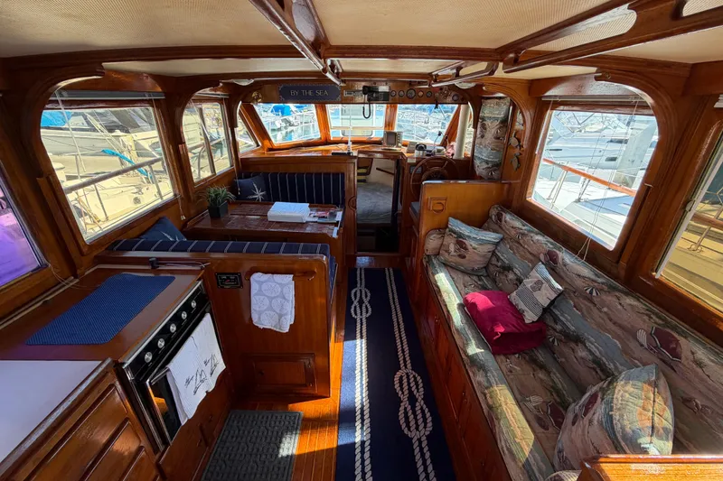 Slide: The Image of Interior of a 1982 Lien Hwa 31 yacht with cozy seating and nautical decor. - 26
