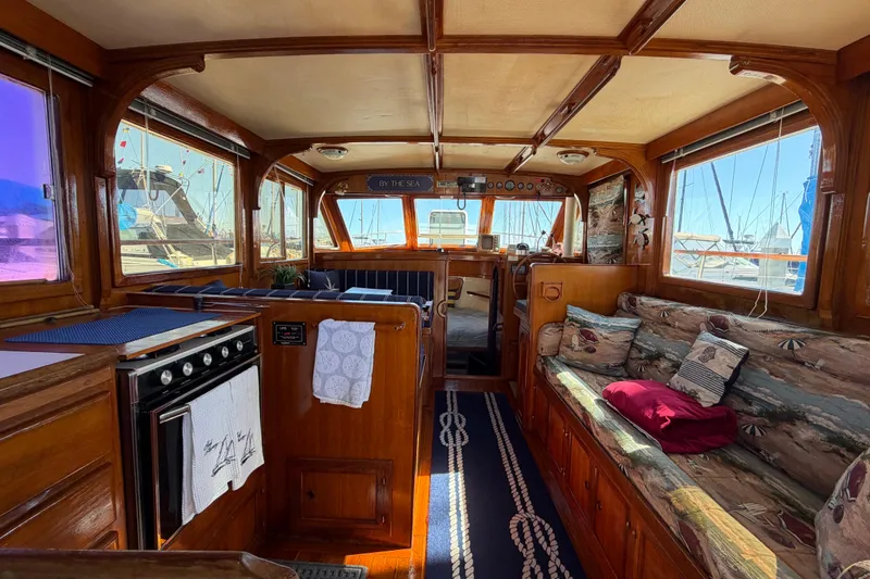 Slide: The Image of Interior of a 1982 Lien Hwa 31 yacht with wood paneling and nautical decor. - 27