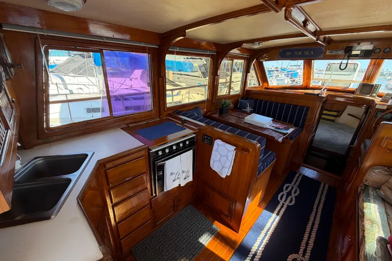 Slide: The Image of Interior of 1982 Lien Hwa 31 yacht with wooden cabinetry and seating area. - 29