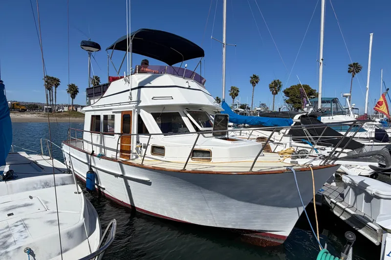 Slide: The Image of 1982 Lien Hwa 31 boat docked at marina with clear blue sky. - 3