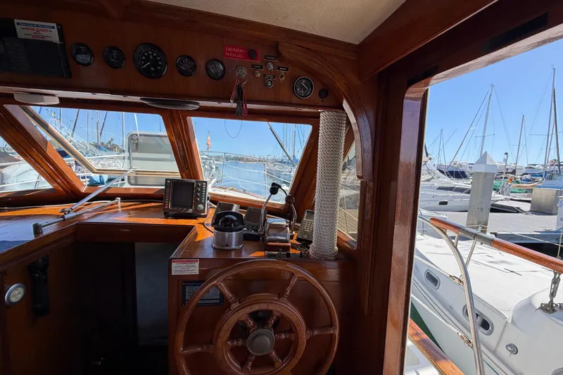 Slide: The Image of Interior view of 1982 Lien Hwa 31 boat cockpit with wooden steering wheel and navigation instruments. - 36