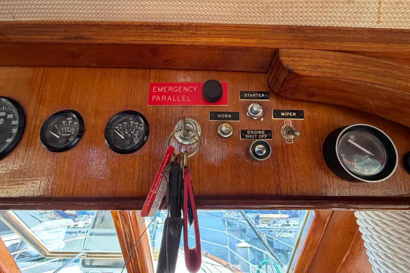 Slide: The Image of Control panel of a 1982 Lien Hwa 31 boat with gauges and switches. - 37
