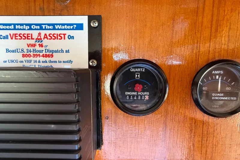 Slide: The Image of Control panel of a 1982 Lien Hwa 31 boat with engine hours and amp gauges. - 39