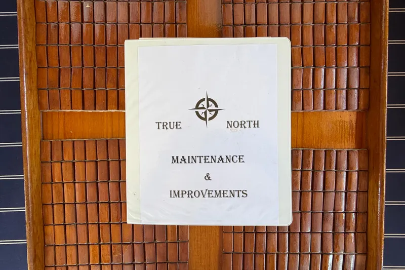 Slide: The Image of Sign reading "True North Maintenance & Improvements" on wooden panel, Lien Hwa 31, 1982. - 41
