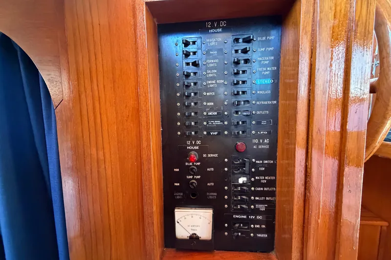 Slide: The Image of Electrical panel on a 1982 Lien Hwa 31 boat, featuring various switches and controls. - 42
