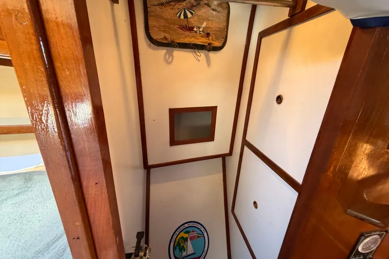 Slide: The Image of Interior of 1982 Lien Hwa 31 boat with wooden trim and nautical decor. - 44