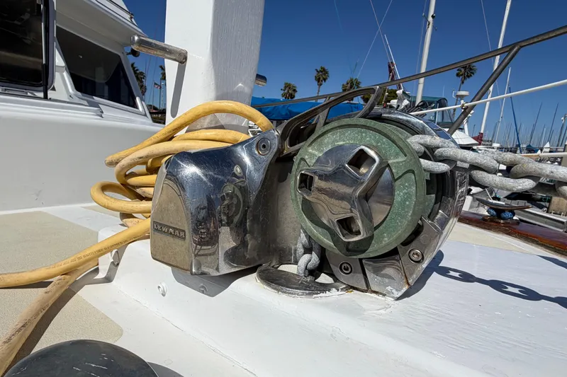 Slide: The Image of Close-up of a 1982 Lien Hwa 31 yacht's anchor windlass with chain and rope. - 5