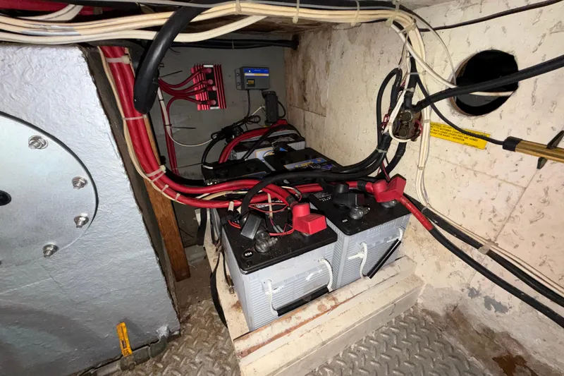 Slide: The Image of Battery compartment of a 1982 Lien Hwa 31 boat, featuring wiring and connections. - 56