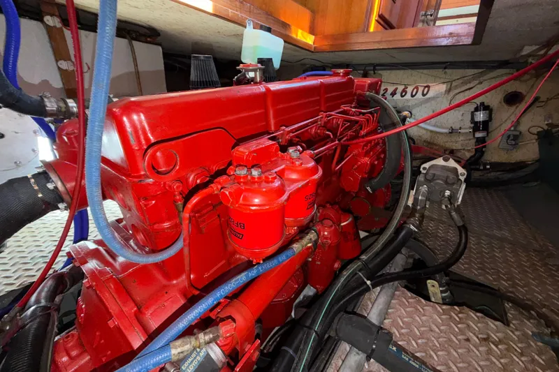 Slide: The Image of Red engine inside 1982 Lien Hwa 31 boat, showcasing mechanical components and wiring. - 58