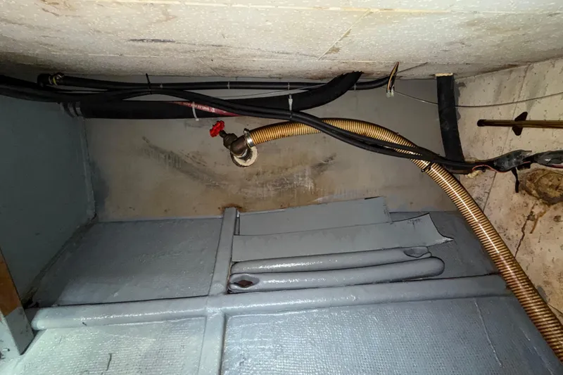 Slide: The Image of Bilge area of a 1982 Lien Hwa 31 boat with hoses and fittings. - 62