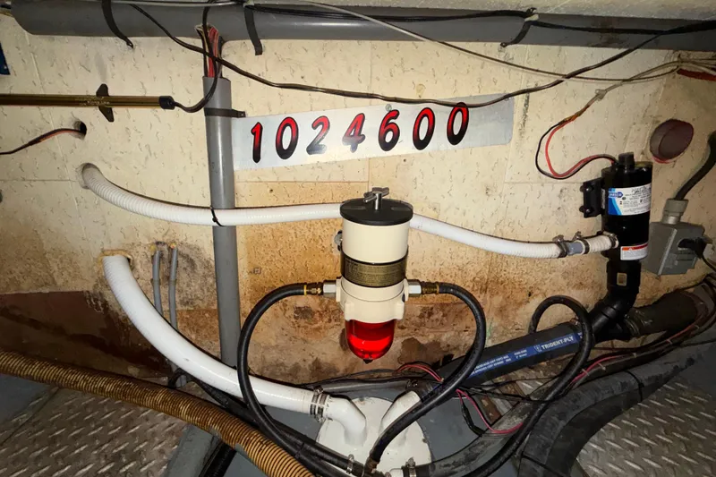 Slide: The Image of Engine room of 1982 Lien Hwa 31 boat with fuel filter and wiring. - 63