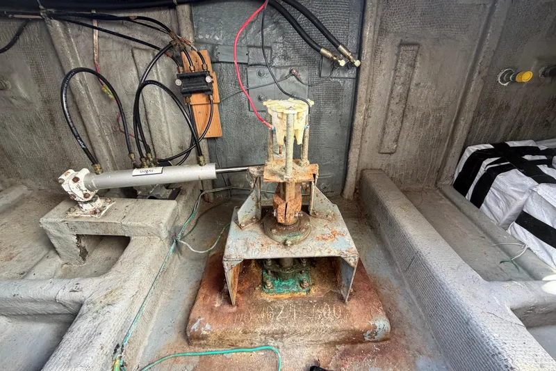 Slide: The Image of Rusty mechanical components inside a 1982 Lien Hwa 31 boat, showing hydraulic and electrical systems. - 68