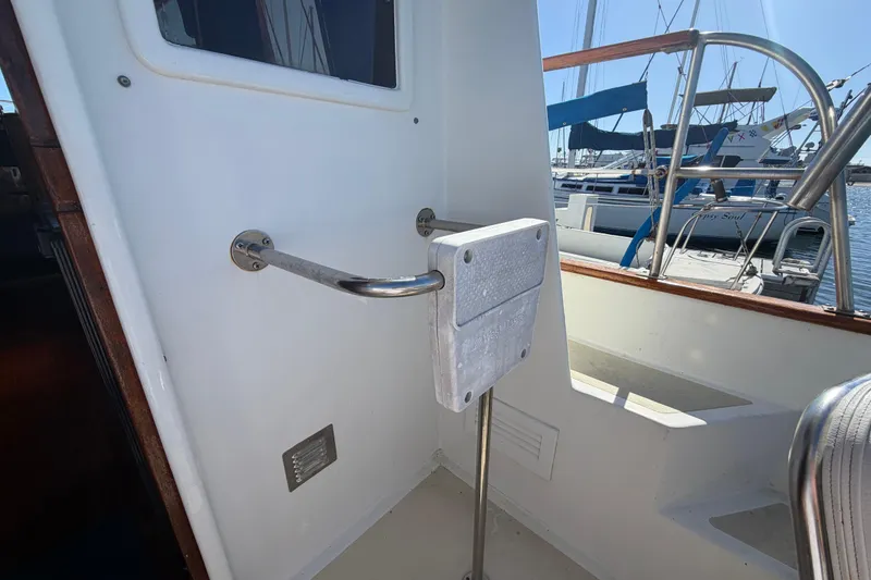 Slide: The Image of 1982 Lien Hwa 31 yacht cockpit with railing and marina view. - 70