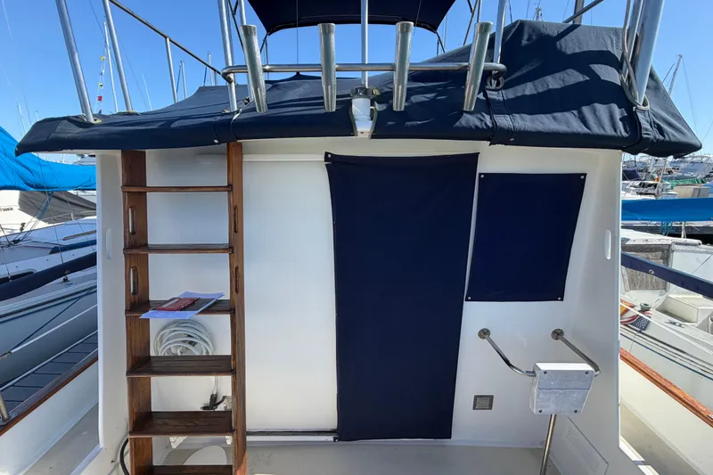 Slide: The Image of 1982 Lien Hwa 31 boat deck with ladder and blue canvas covers. - 76