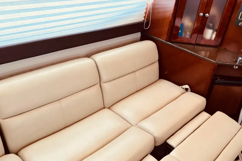 Slide: The Image of Luxurious beige leather seating in 2011 Meridian 441 Sedan yacht interior. - 10
