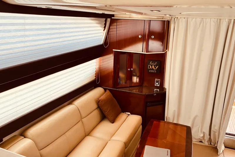 Slide: The Image of Luxurious interior of a 2011 Meridian 441 Sedan yacht with beige leather seating. - 11