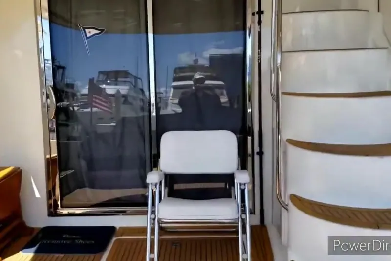 Slide: The Image of 2011 Meridian 441 Sedan yacht interior with chair and spiral staircase. - 6