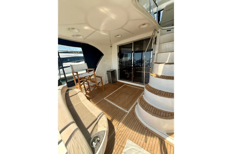 Slide: The Image of Spacious deck of 2011 Meridian 441 Sedan yacht with seating and stairs. - 7