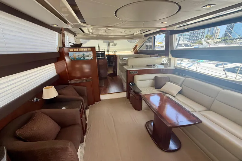 Slide: The Image of Luxurious interior of a 2011 Meridian 441 Sedan yacht with elegant seating and wood finishes. - 8