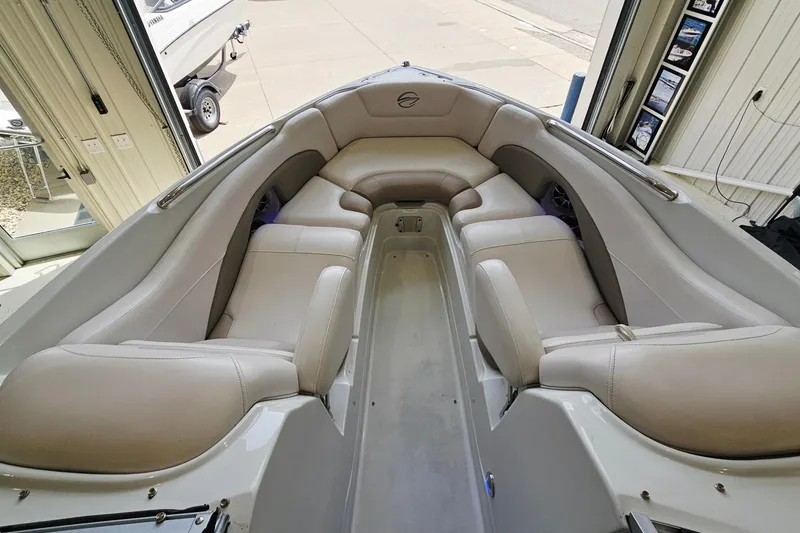 Slide: The Image of Interior view of 2014 Crownline 255 SS boat with beige seating. - 15