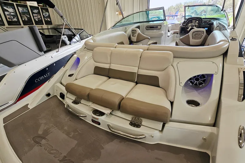 Slide: The Image of 2014 Crownline 255 SS boat interior with beige seating and modern design features. - 9