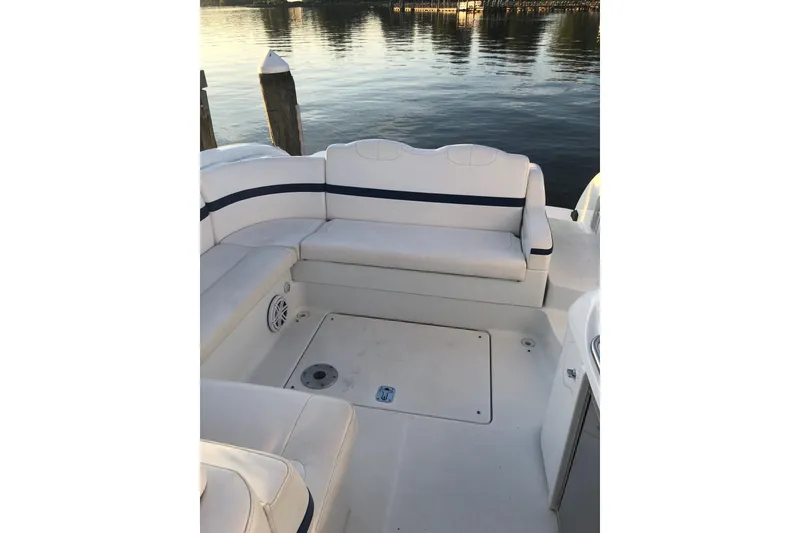 Slide: The Image of 2009 Formula 350 Sun Sport boat interior with white seating and waterfront view. - 7