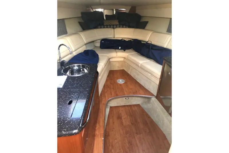 Slide: The Image of Luxurious interior of a 2009 Formula 350 Sun Sport boat with plush seating and kitchenette. - 9