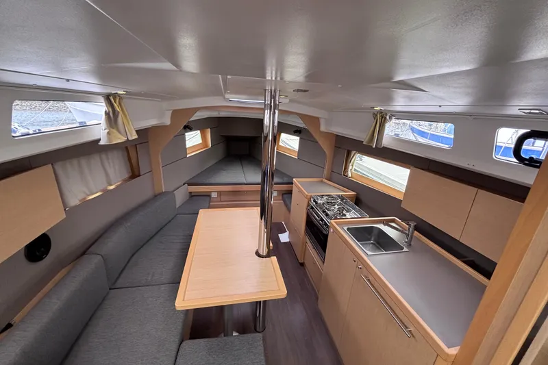 Slide: The Image of Interior of 2015 Beneteau Oceanis 35 sailboat with modern kitchen and seating area. - 10