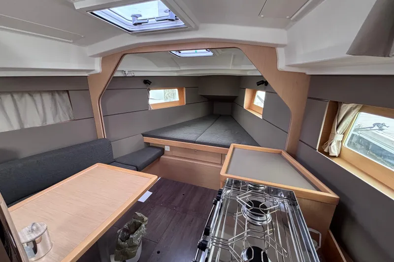 Slide: The Image of Interior of 2015 Beneteau Oceanis 35 sailboat, featuring cozy cabin and modern kitchen area. - 12