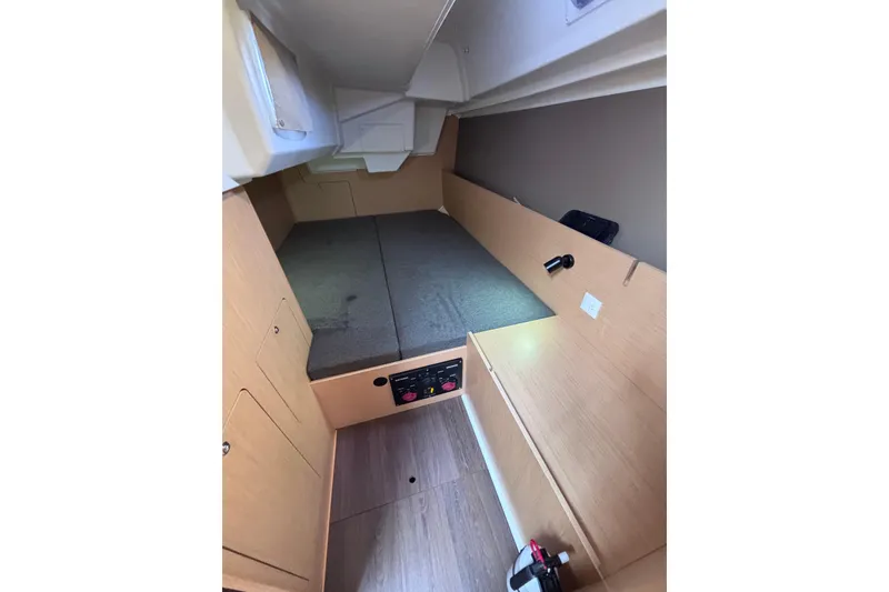 Slide: The Image of Interior cabin of 2015 Beneteau Oceanis 35 sailboat, featuring a cozy sleeping area. - 19