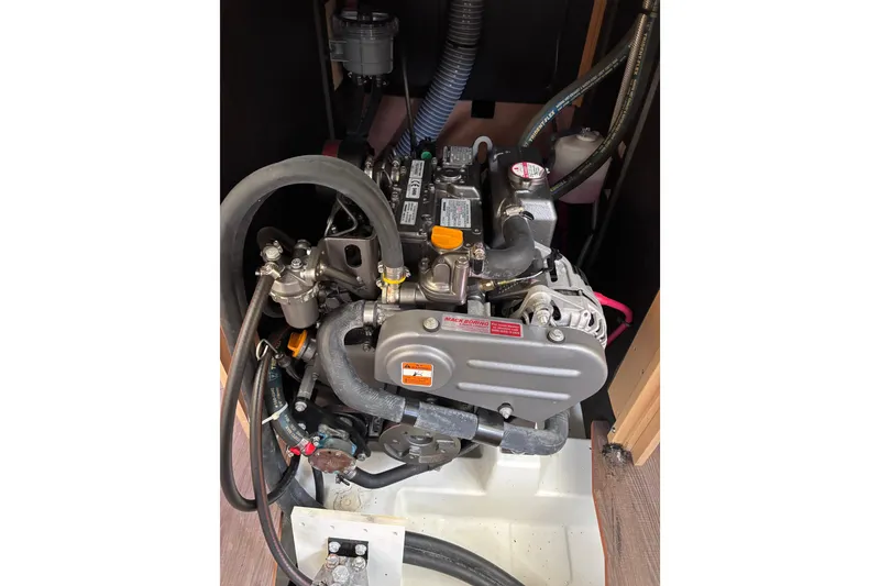 Slide: The Image of Engine compartment of a 2015 Beneteau Oceanis 35 sailboat, showcasing mechanical components. - 22